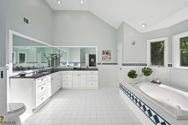 1 Colby Farm Rd, Chester Twp, NJ 07930 - full bath with vanity, high vaulted ceiling, a tub with jets, toilet, and tile patterned floors
