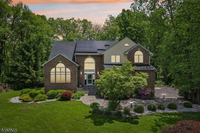 1 Colby Farm Rd, Chester Twp, NJ 07930 - traditional home with a yard, solar panels, and brick siding