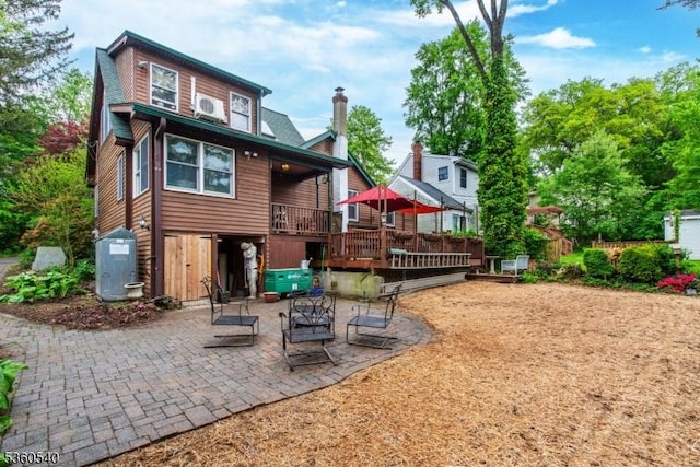14 Lindberg Trl, Rockaway Twp, NJ 07866 - back of property featuring a patio, a deck, a chimney, and cooling unit