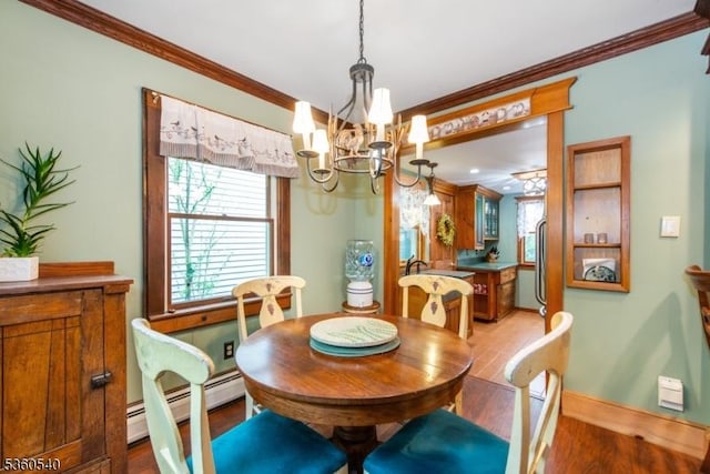 14 Lindberg Trl, Rockaway Twp, NJ 07866 - dining room with a chandelier, crown molding, wood finished floors, a baseboard heating unit, and baseboards