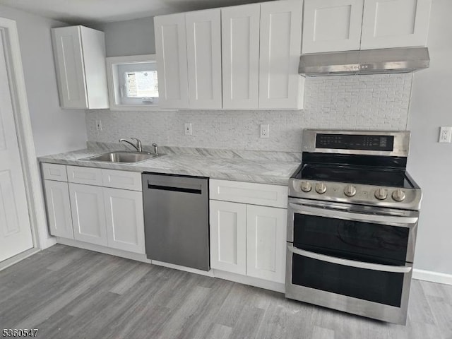 61 Bauer Rd, Frankford Twp, NJ 07860 - kitchen with stainless steel appliances, under cabinet range hood, a sink, white cabinetry, and light wood-type flooring