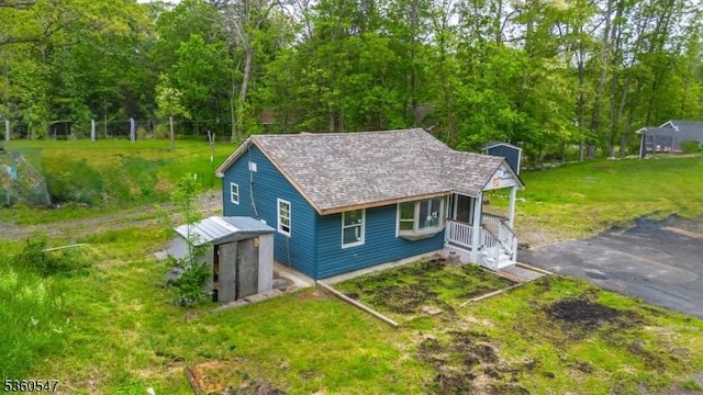 61 Bauer Rd, Frankford Twp, NJ 07860 - view of front facade featuring a front lawn and a shingled roof