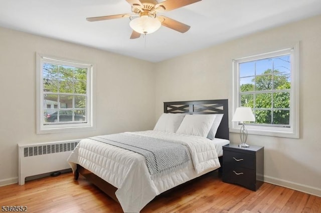 43A W Roselle Ave, Roselle Park Boro, NJ 07204 - bedroom featuring radiator heating unit, multiple windows, and baseboards