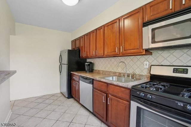 43A W Roselle Ave, Roselle Park Boro, NJ 07204 - kitchen with stainless steel appliances, a sink, backsplash, light tile patterned floors, and light countertops