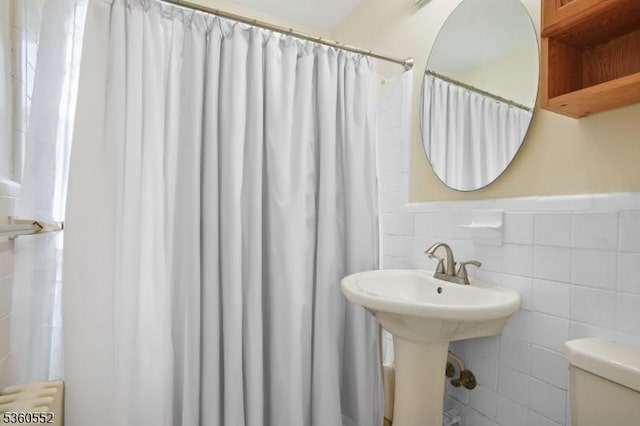 43A W Roselle Ave, Roselle Park Boro, NJ 07204 - bathroom with tile walls, radiator, toilet, a shower with curtain, and a sink