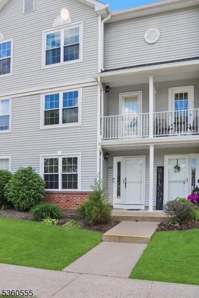 302 Mercer Ct, Independence Twp, NJ 07840 - multi unit property with brick siding, a front lawn, and a balcony