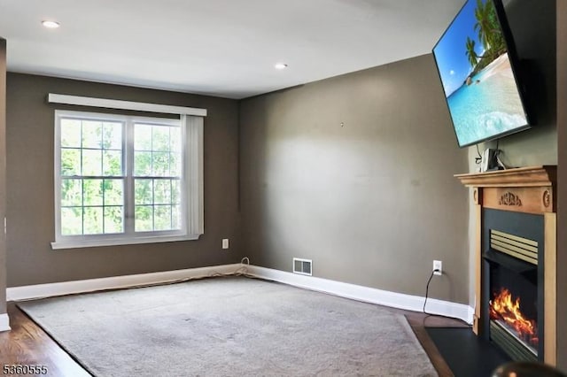 302 Mercer Ct, Independence Twp, NJ 07840 - unfurnished living room featuring a glass covered fireplace, baseboards, dark wood finished floors, and recessed lighting