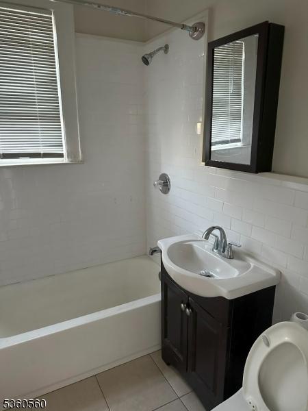 14 Nelson Pl, Maplewood Twp, NJ 07040 - full bath with vanity, tub / shower combination, tile patterned floors, and toilet