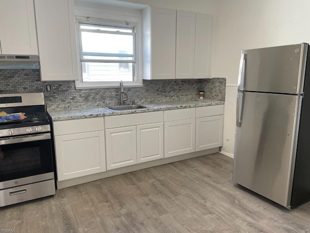 14 Nelson Pl, Maplewood Twp, NJ 07040 - kitchen featuring stainless steel appliances, a sink, under cabinet range hood, and white cabinets