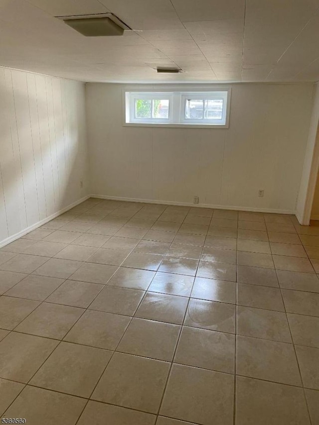 14 Nelson Pl, Maplewood Twp, NJ 07040 - spare room with light tile patterned floors, baseboards, and wood walls