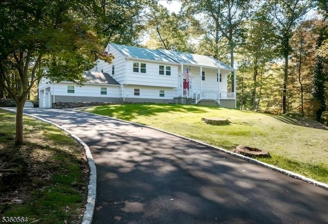 37 King George Rd, Warren Twp, NJ 07059 - raised ranch with driveway, a front lawn, a garage, and a porch