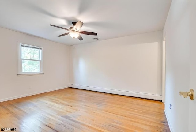 37 King George Rd, Warren Twp, NJ 07059 - empty room with light wood finished floors, a ceiling fan, baseboards, and a baseboard radiator