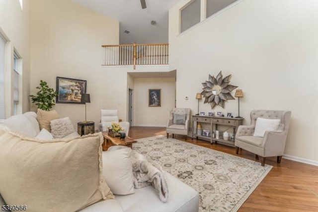 6 Apgar Ct, Raritan Twp, NJ 08822 - living room featuring a high ceiling, baseboards, wood finished floors, and a ceiling fan