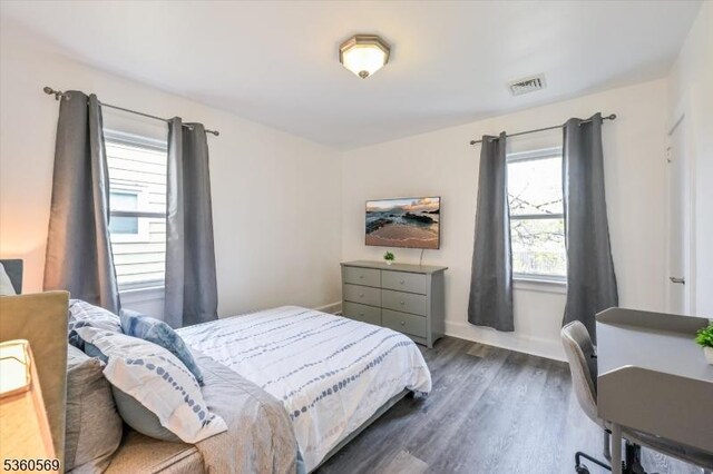 1036 Creger Ave, Union Twp, NJ 07083 - bedroom with multiple windows, dark wood-style floors, and baseboards