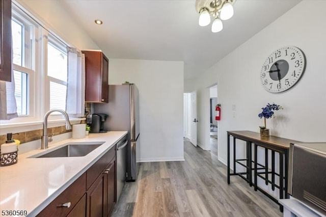 1036 Creger Ave, Union Twp, NJ 07083 - kitchen with a sink, light countertops, ceiling fan, light wood finished floors, and stainless steel dishwasher