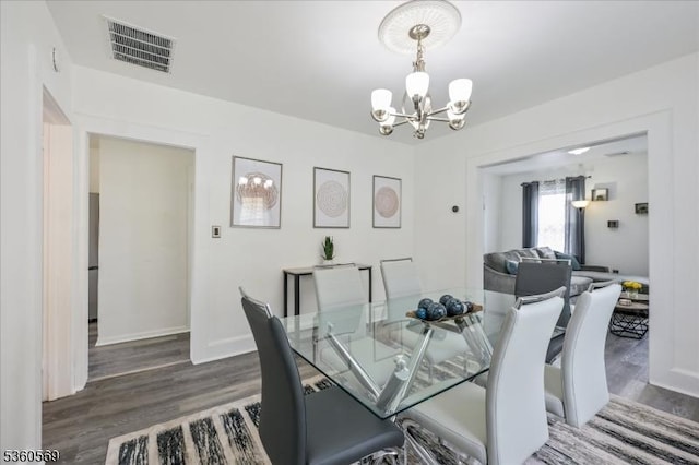 1036 Creger Ave, Union Twp, NJ 07083 - dining room with a chandelier, wood finished floors, and baseboards