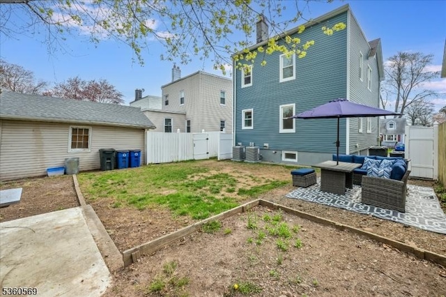 1036 Creger Ave, Union Twp, NJ 07083 - back of property with an outdoor hangout area, a gate, a garden, and a patio