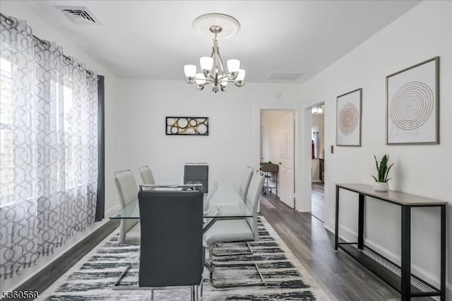 1036 Creger Ave, Union Twp, NJ 07083 - dining area featuring dark wood-style floors, a chandelier, and baseboards