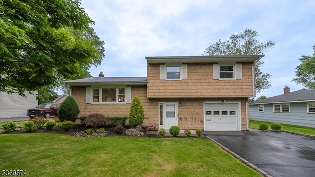 813 Riverbend Dr, Clark Twp, NJ 07066 - split level home with an attached garage, asphalt driveway, and a front yard