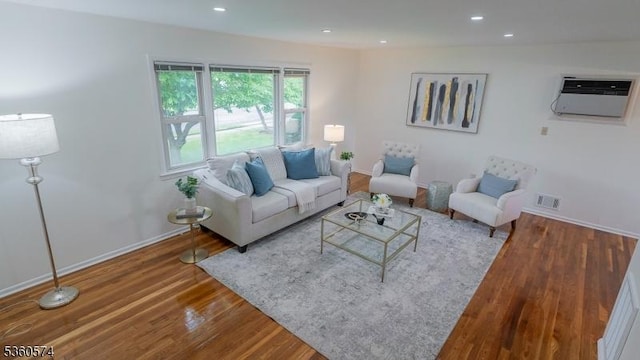813 Riverbend Dr, Clark Twp, NJ 07066 - living room featuring wood finished floors, an AC wall unit, baseboards, and recessed lighting
