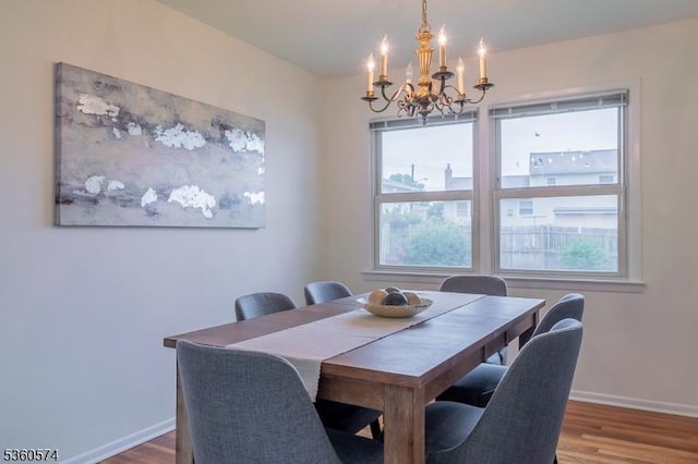 813 Riverbend Dr, Clark Twp, NJ 07066 - dining area featuring a chandelier, wood finished floors, and healthy amount of natural light