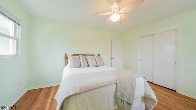 813 Riverbend Dr, Clark Twp, NJ 07066 - bedroom with baseboards, wood finished floors, a closet, and a ceiling fan