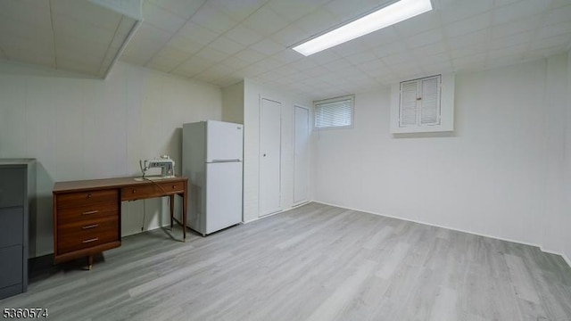 813 Riverbend Dr, Clark Twp, NJ 07066 - finished below grade area with freestanding refrigerator and light wood-style flooring