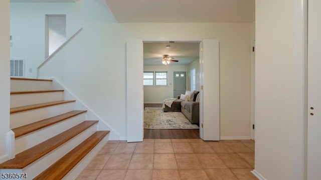 813 Riverbend Dr, Clark Twp, NJ 07066 - stairs with a ceiling fan, tile patterned flooring, and baseboards