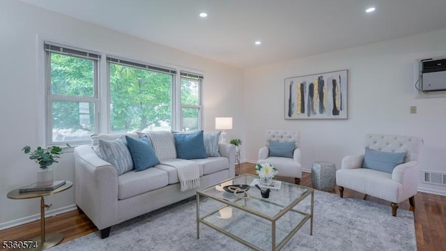 813 Riverbend Dr, Clark Twp, NJ 07066 - living room featuring wood finished floors, recessed lighting, baseboards, and a wall mounted air conditioner