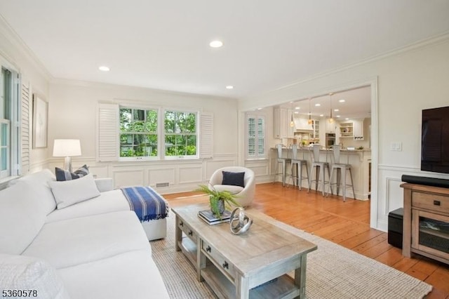 5 Barry Ln, Millburn Twp, NJ 07078 - living area featuring a decorative wall, crown molding, hardwood / wood-style flooring, a wainscoted wall, and recessed lighting