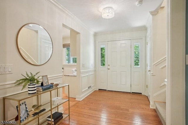 5 Barry Ln, Millburn Twp, NJ 07078 - foyer featuring light wood-style floors, ornamental molding, and a decorative wall