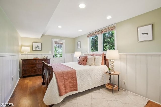 5 Barry Ln, Millburn Twp, NJ 07078 - bedroom with wainscoting, a decorative wall, recessed lighting, and wood finished floors