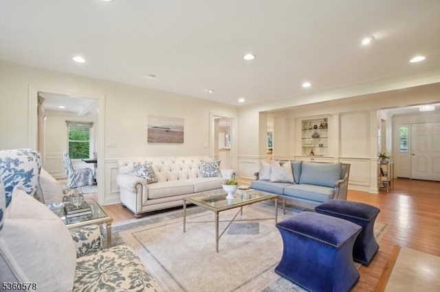 5 Barry Ln, Millburn Twp, NJ 07078 - living room featuring a decorative wall, wood finished floors, ornamental molding, wainscoting, and recessed lighting