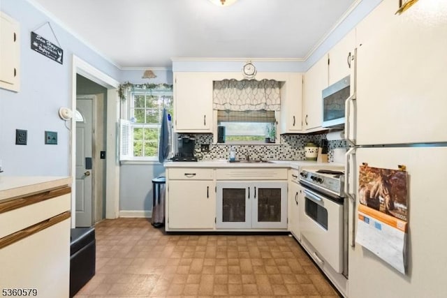 274 Diamond Hill Rd, Berkeley Heights Twp, NJ 07922 - kitchen with white appliances, light countertops, a sink, ornamental molding, and light flooring