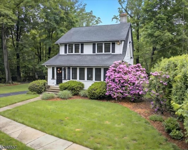 246 Park Ave, Allendale Boro, NJ 07401 - view of front of home with a chimney, a front yard, and roof with shingles