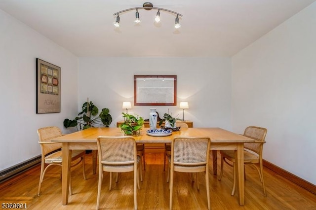 81 Coppermine Rd, Franklin Twp, NJ 08540 - dining space with light wood-style floors, baseboards, and baseboard heating
