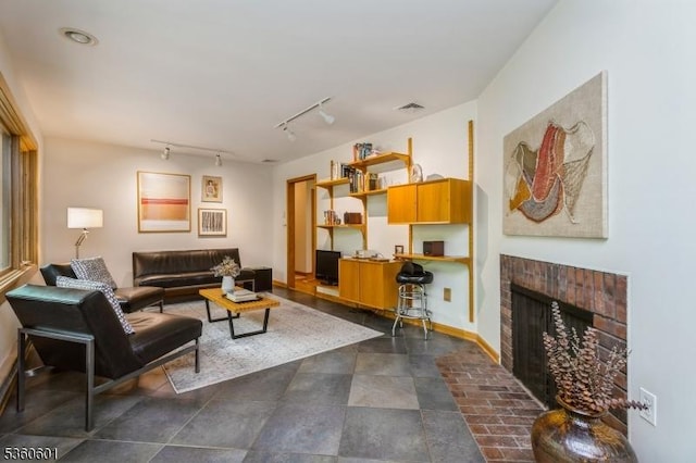81 Coppermine Rd, Franklin Twp, NJ 08540 - living area featuring track lighting, a brick fireplace, and baseboards