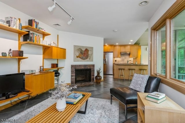81 Coppermine Rd, Franklin Twp, NJ 08540 - living room featuring a fireplace, recessed lighting, and track lighting