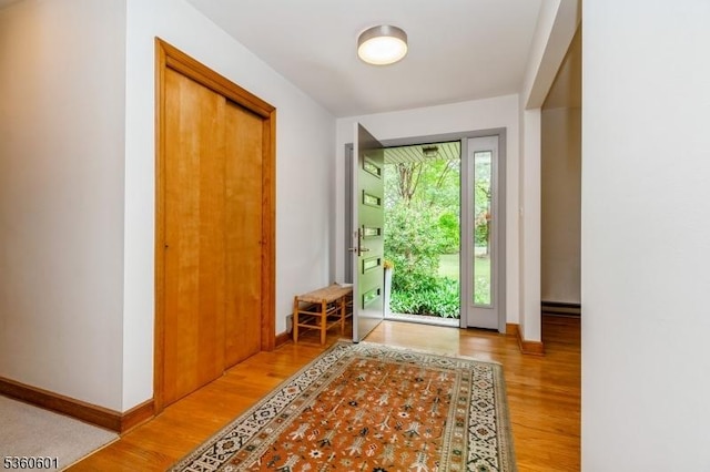 81 Coppermine Rd, Franklin Twp, NJ 08540 - foyer entrance featuring wood finished floors, baseboards, and baseboard heating