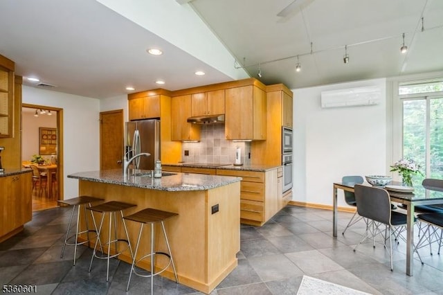 81 Coppermine Rd, Franklin Twp, NJ 08540 - kitchen featuring stainless steel appliances, a sink, under cabinet range hood, dark stone countertops, and decorative backsplash