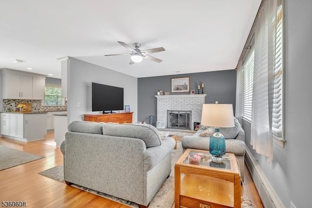 11 Anne St, Hillsborough Twp, NJ 08844 - living room featuring a ceiling fan, light wood finished floors, and a fireplace