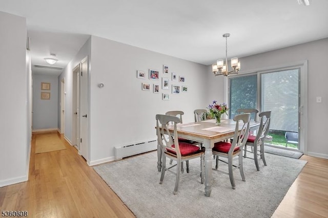 11 Anne St, Hillsborough Twp, NJ 08844 - dining space with light wood-style floors, a chandelier, a baseboard radiator, and baseboards