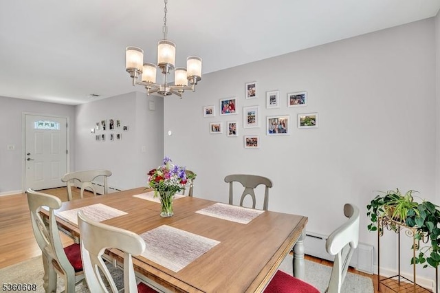 11 Anne St, Hillsborough Twp, NJ 08844 - dining space featuring a chandelier, light wood finished floors, and baseboards