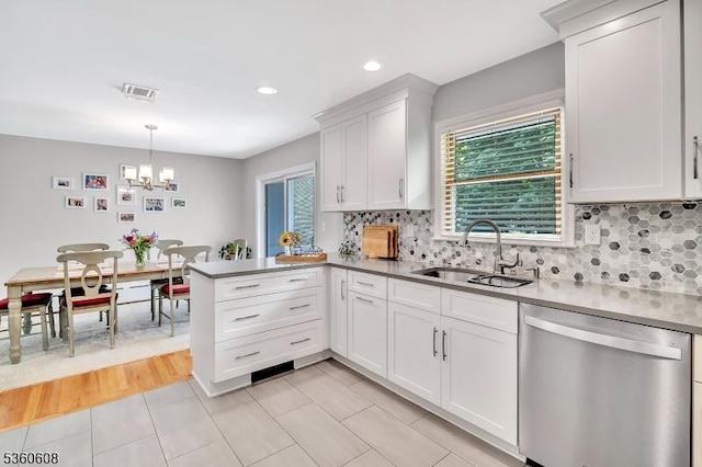 11 Anne St, Hillsborough Twp, NJ 08844 - kitchen featuring dishwasher, a sink, a chandelier, a peninsula, and plenty of natural light