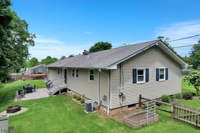 11 Anne St, Hillsborough Twp, NJ 08844 - rear view of house with an outdoor fire pit, a patio, central air condition unit, and a shingled roof