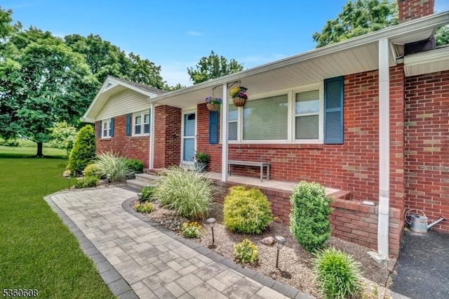 11 Anne St, Hillsborough Twp, NJ 08844 - ranch-style home with brick siding, a front lawn, and covered porch