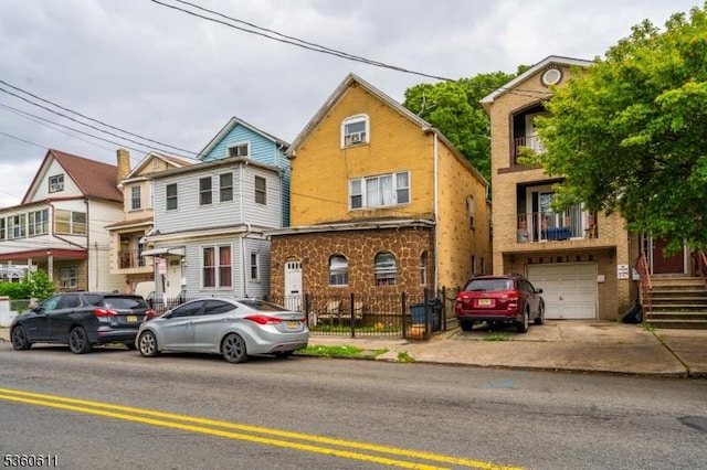 159 2nd St, Elizabeth City, NJ 07206 - view of property with brick siding and an attached garage