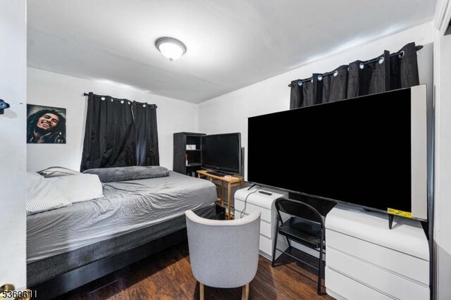 159 2nd St, Elizabeth City, NJ 07206 - bedroom with dark wood-type flooring