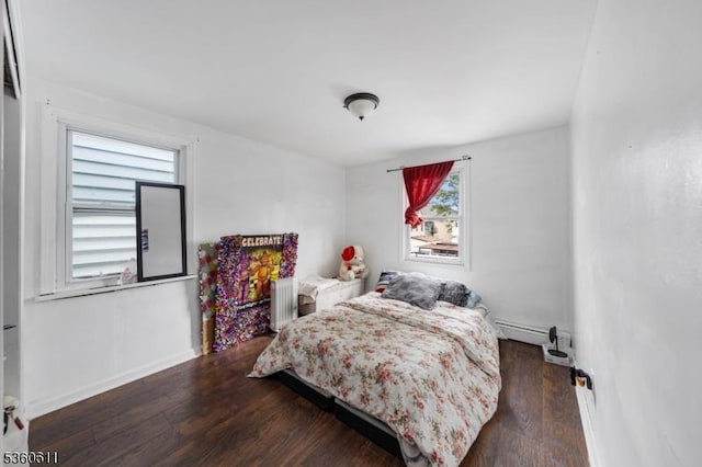 159 2nd St, Elizabeth City, NJ 07206 - bedroom with wood finished floors, radiator, baseboards, and a baseboard radiator