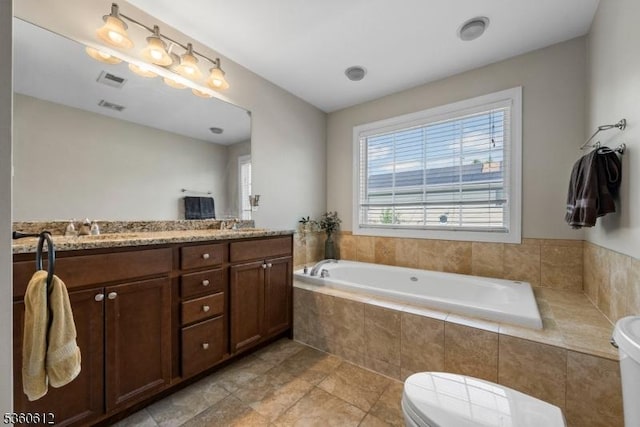 143 Oak St, Bridgewater Twp, NJ 08807 - bathroom featuring toilet, double vanity, and a garden tub